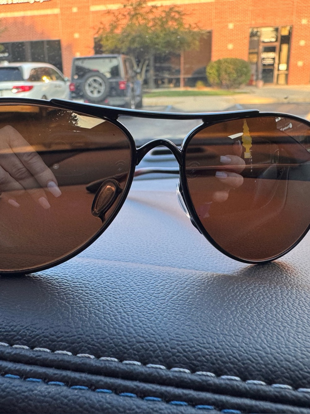 Oakley Women's Black Frame Sunglasses with Brown Lenses